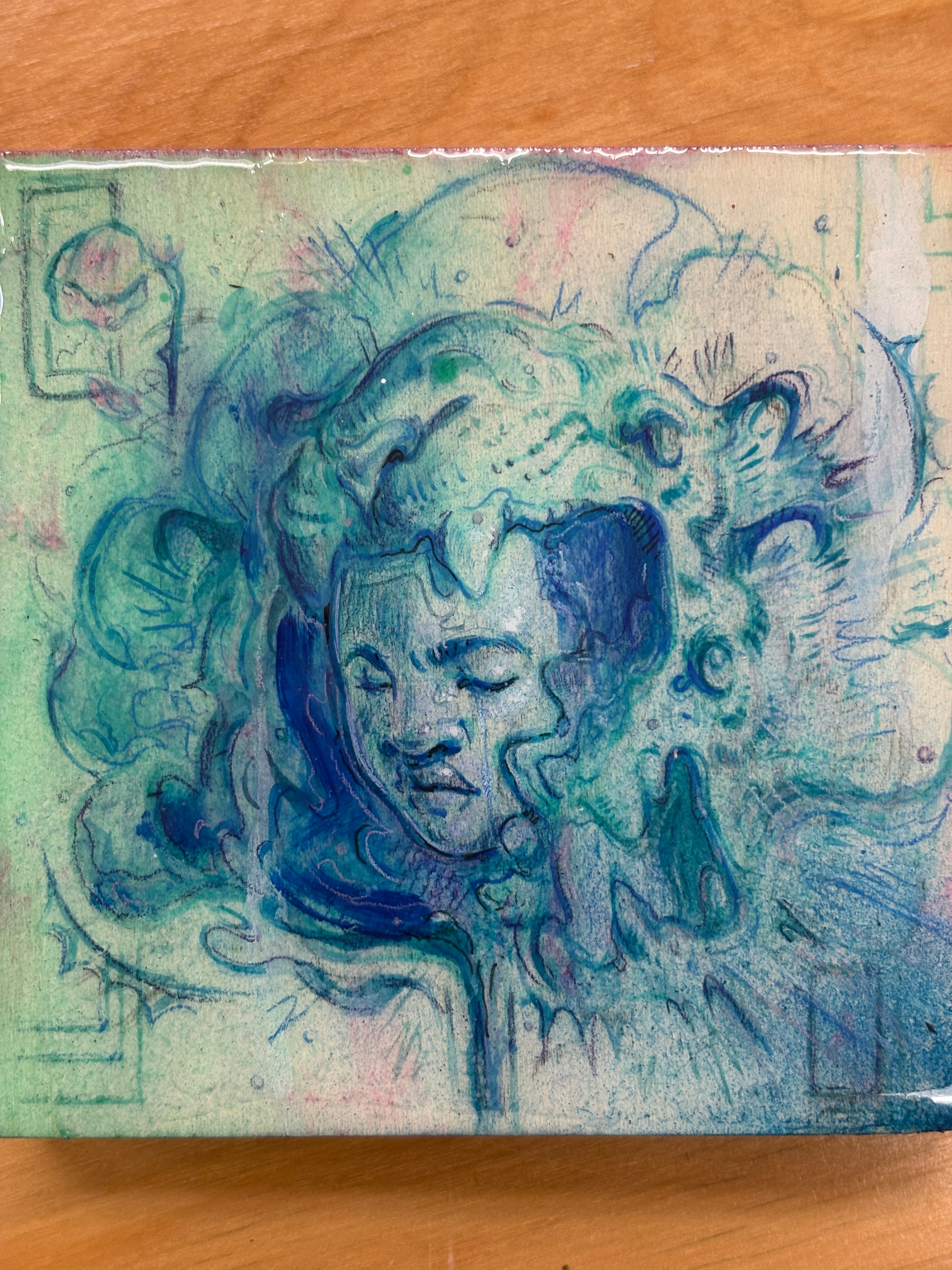 Artistic depiction of a lion's head with blue and green colors on a textured surface.