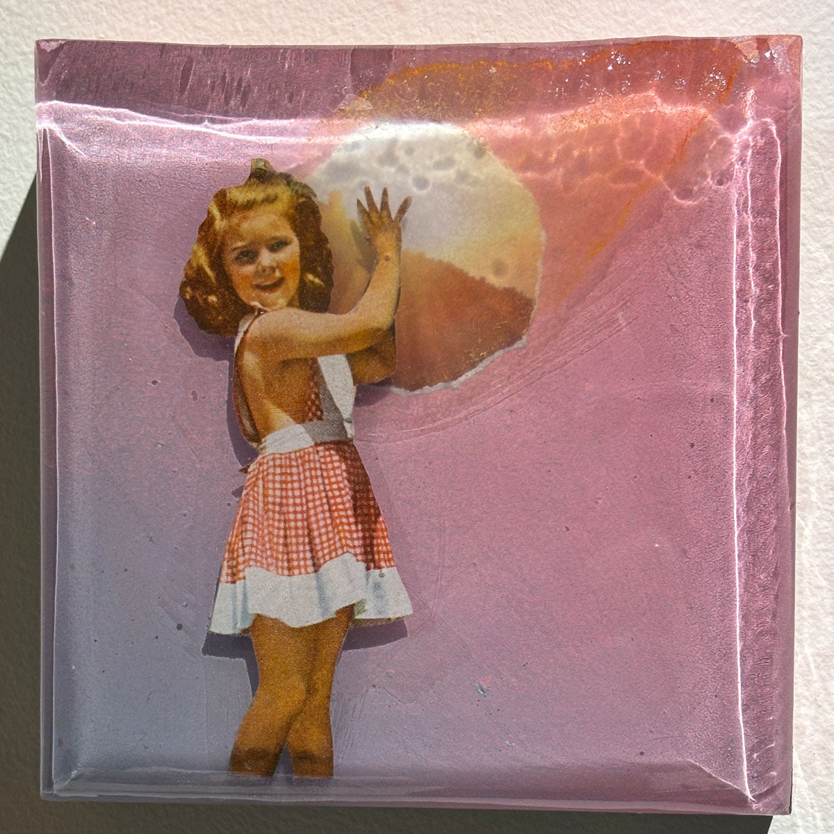 Vintage-style illustration of a girl in a checkered dress with a pink background