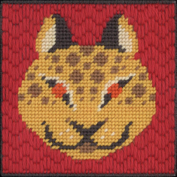 Embroidered design of a lynx face on a red background