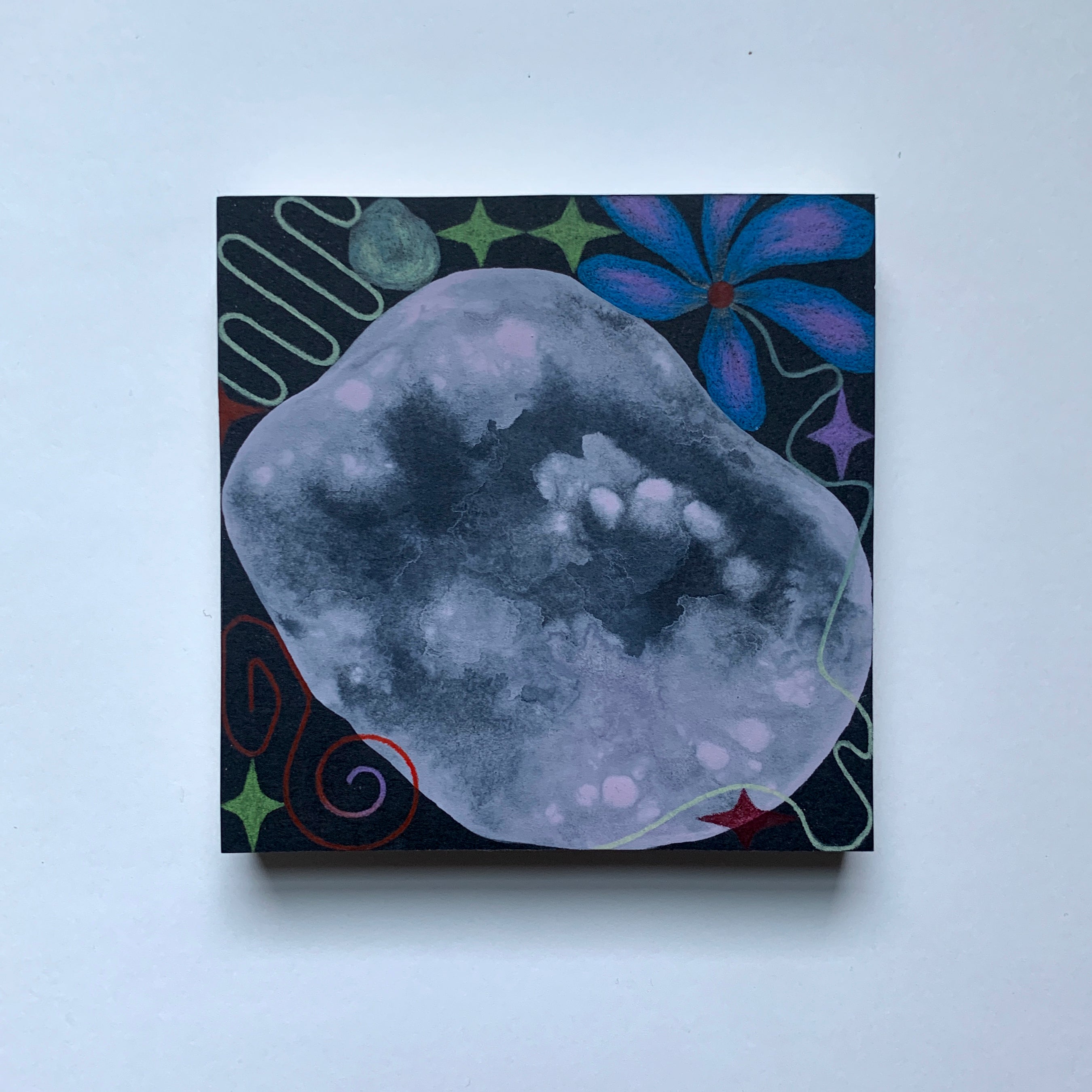 Square tile with abstract design featuring a gray cloud-like shape on a black background with colorful floral and geometric elements.