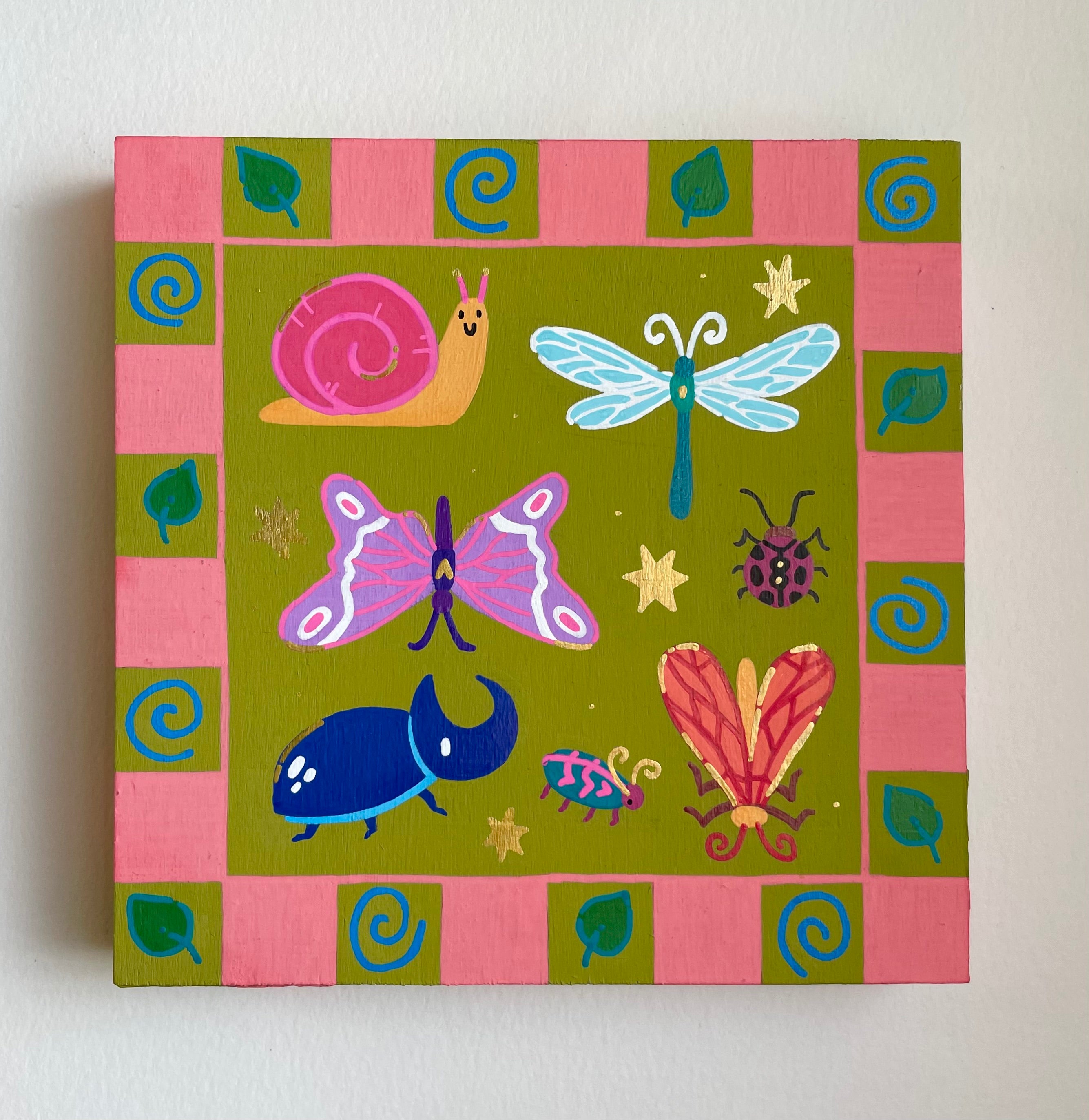 Canvas painting of colorful insects on a green background with pink border
