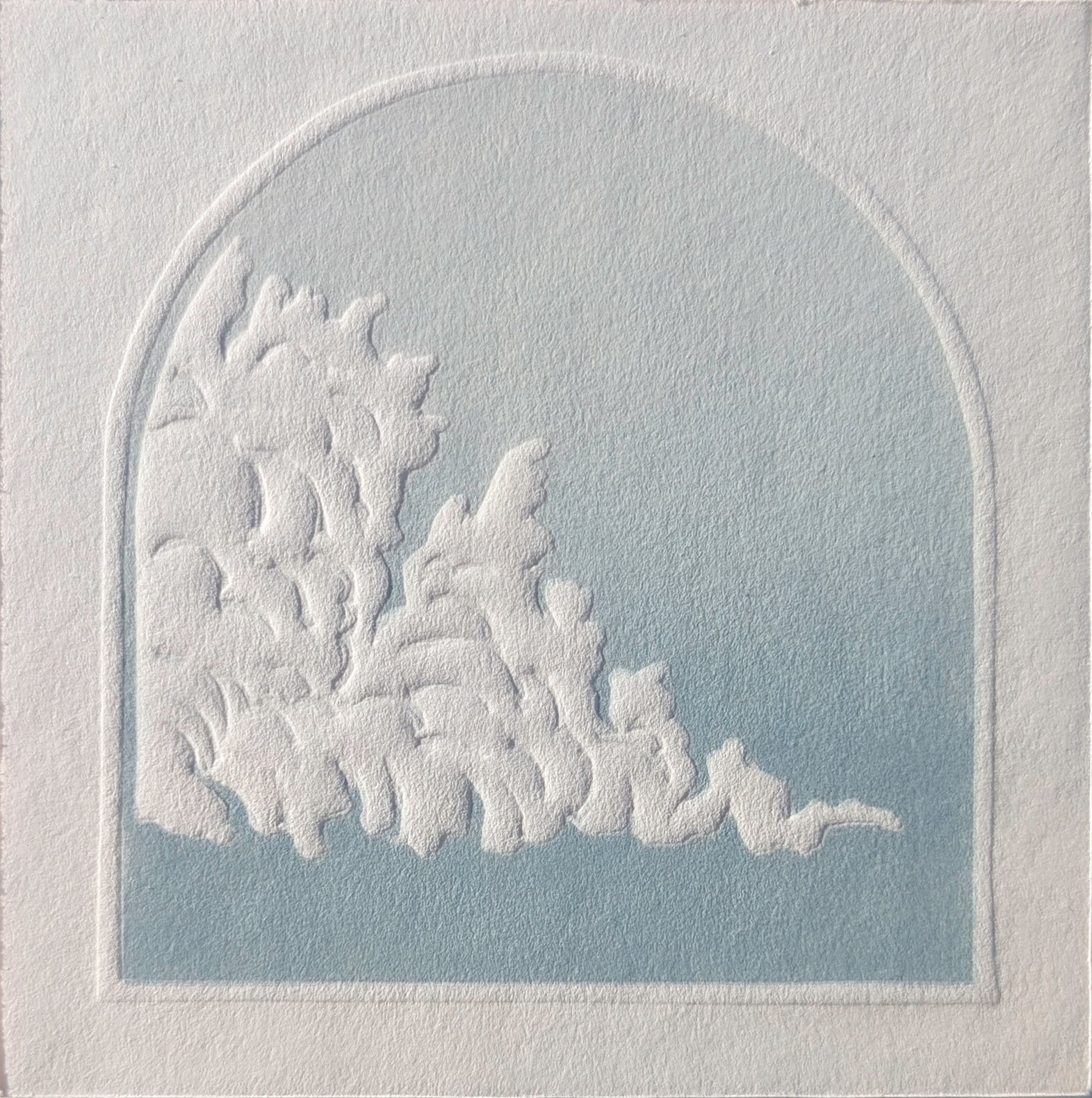 Decorative white embossed design on a textured gray background