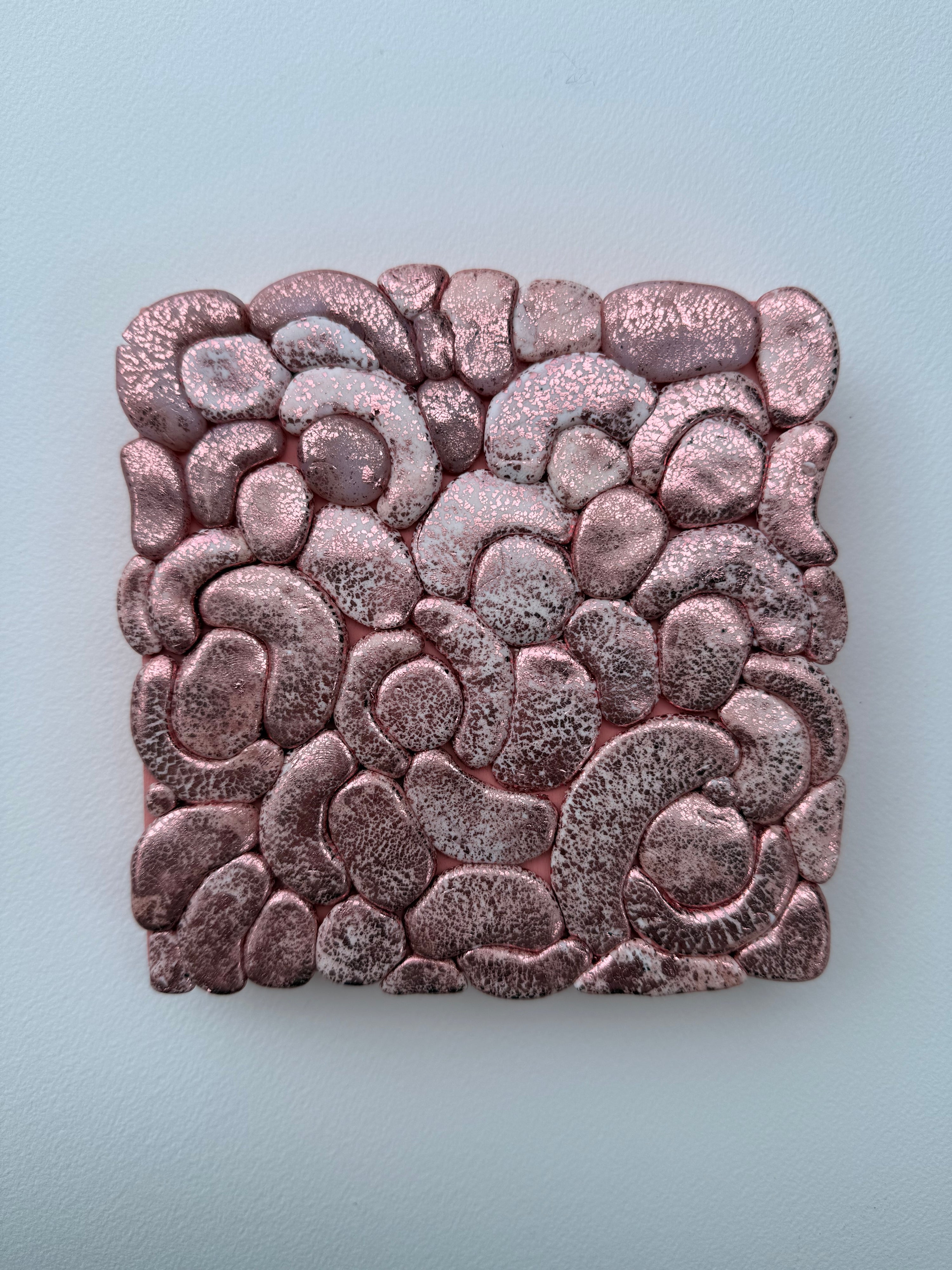 Decorative stone with a textured pattern on a light blue background