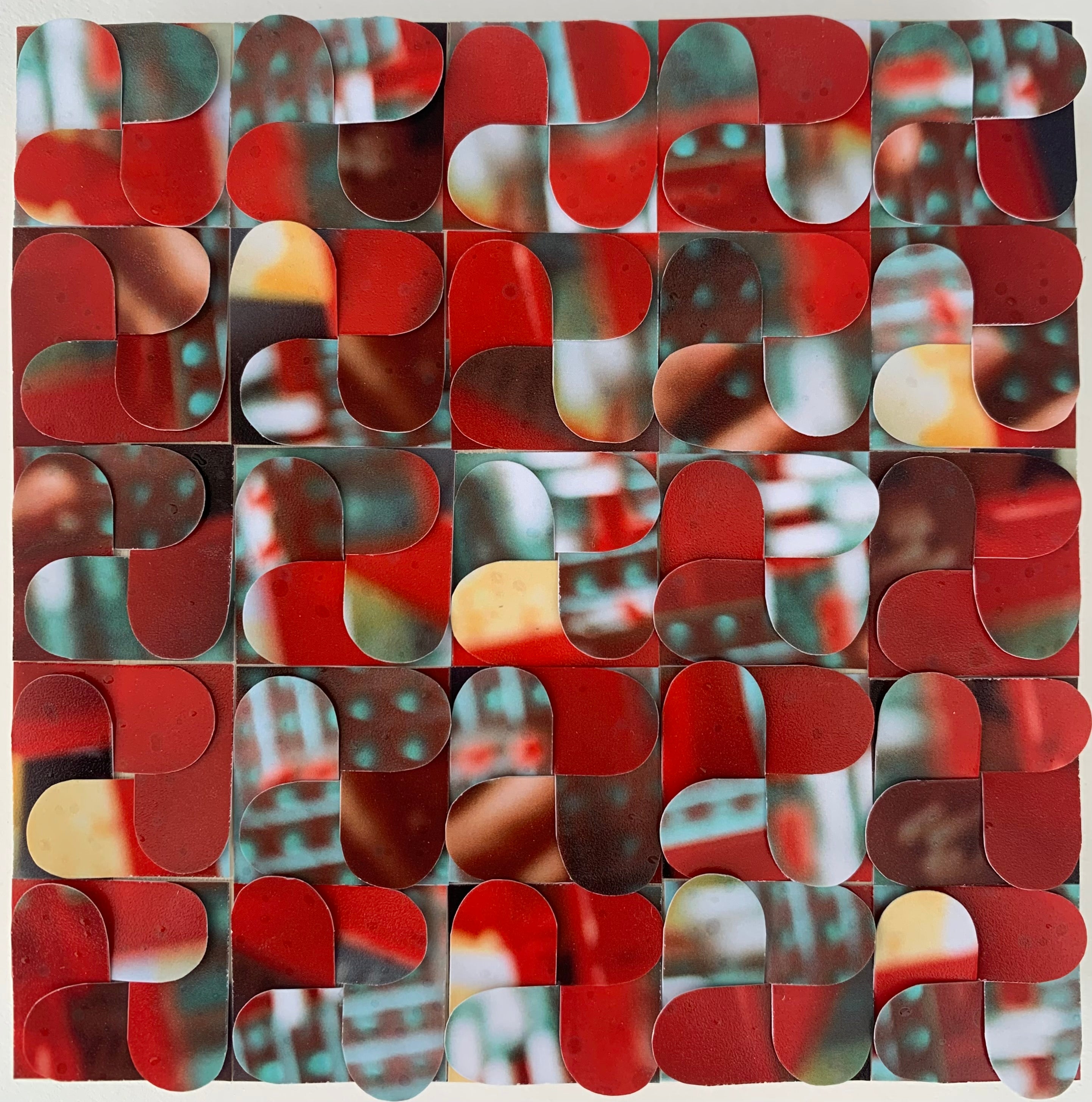 Abstract pattern of red and brown shapes on a textured background
