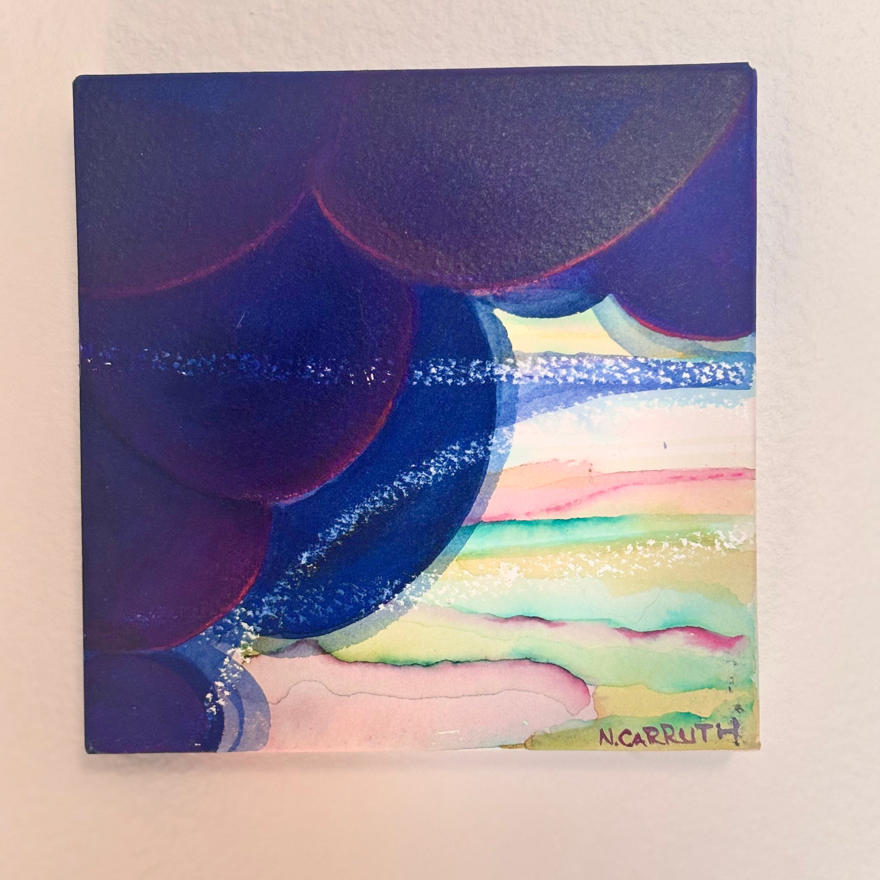 Abstract painting with colorful circular shapes on a light background