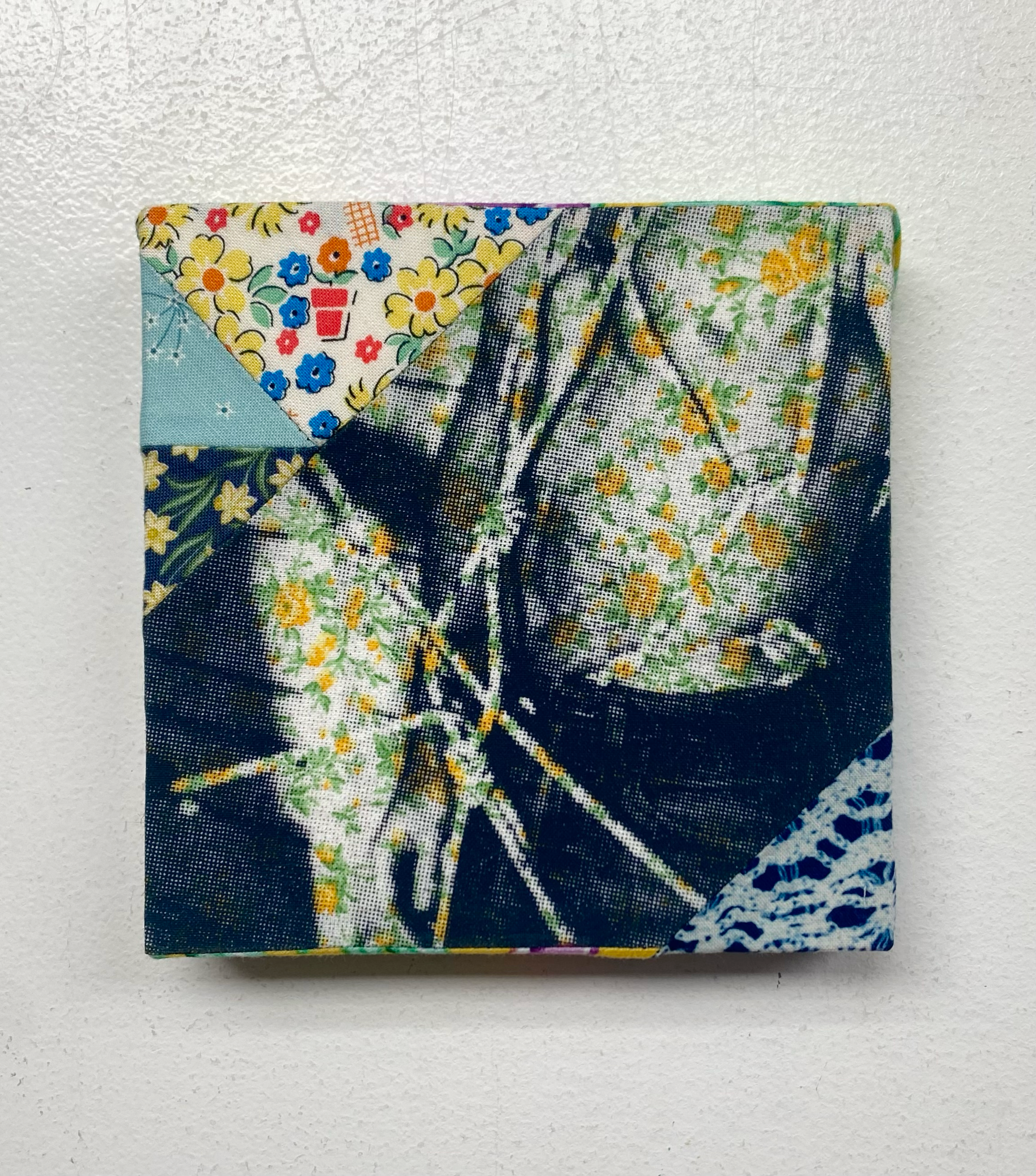 Fabric square with floral patterns on a white background