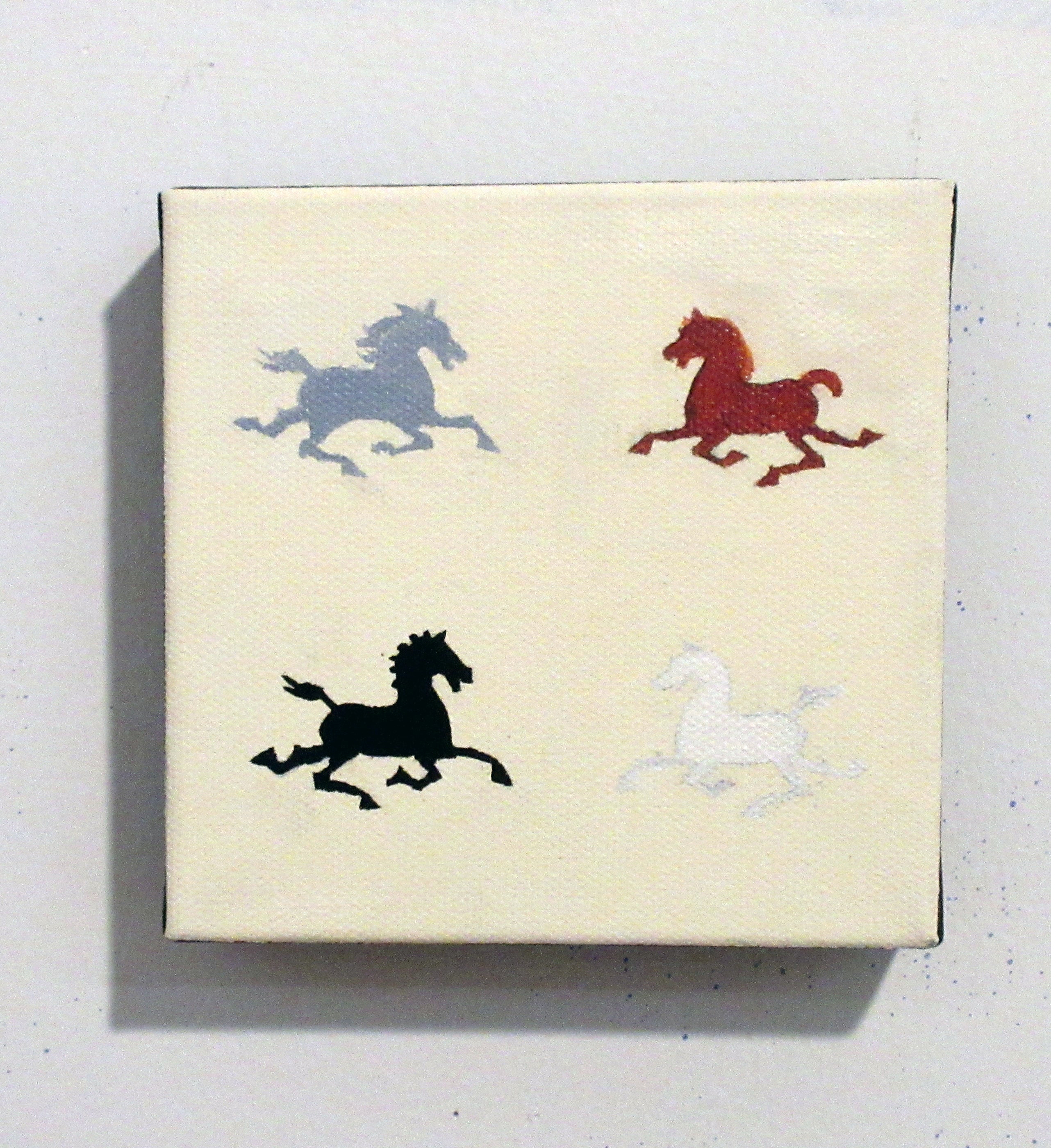 Box with horse illustrations in various colors on a light background