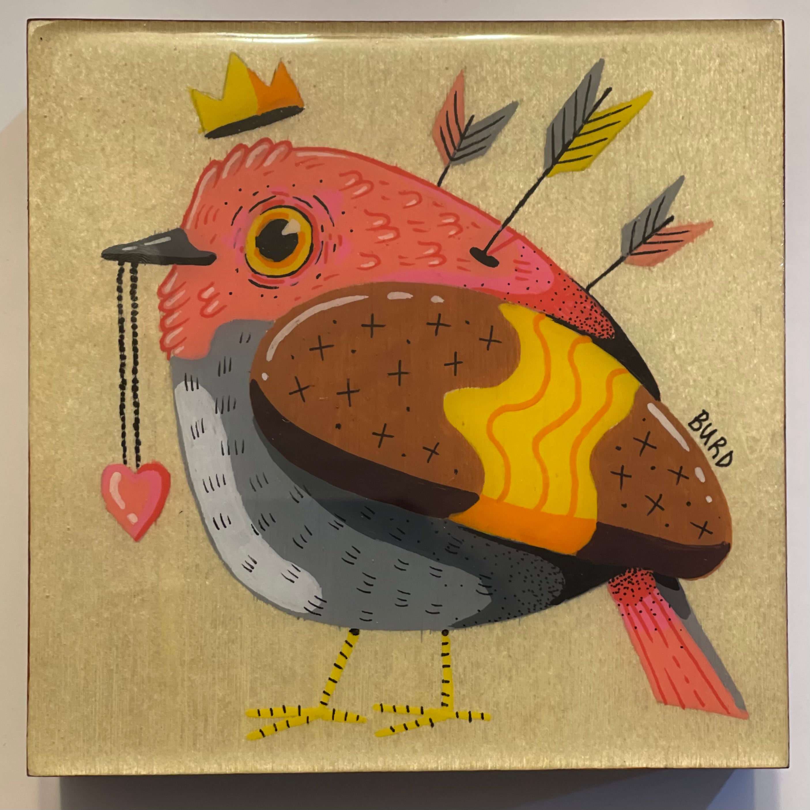 Colorful bird illustration with a crown, heart, and arrows on a gold background