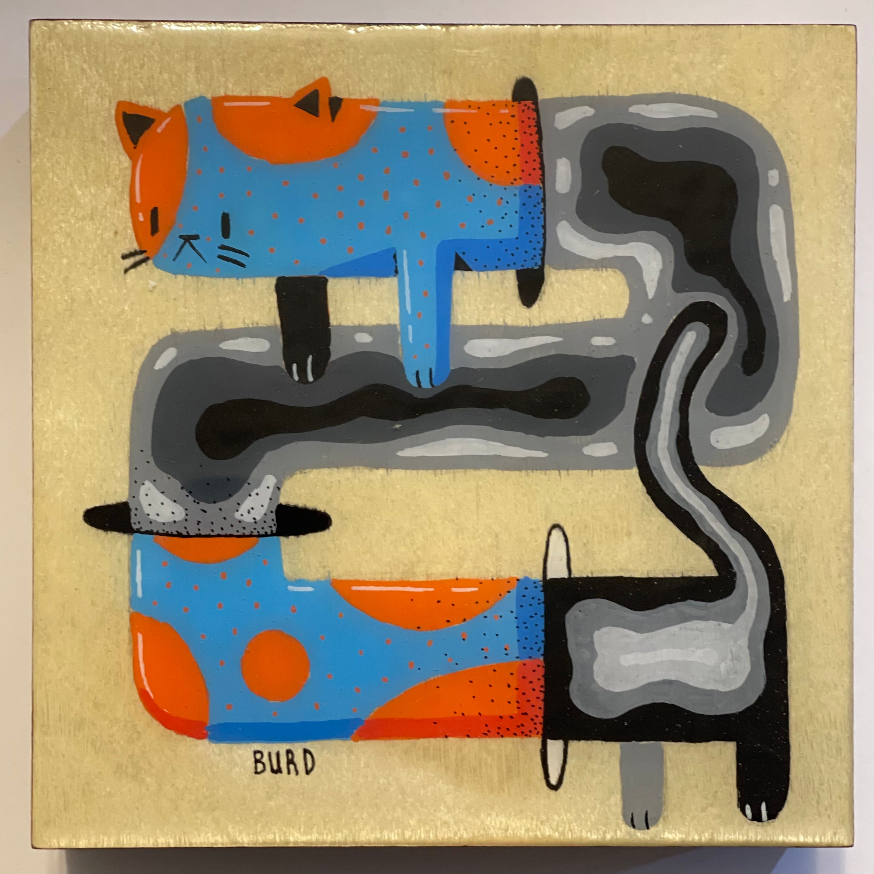 Abstract artwork of a cat with blue and orange patterns on a beige background