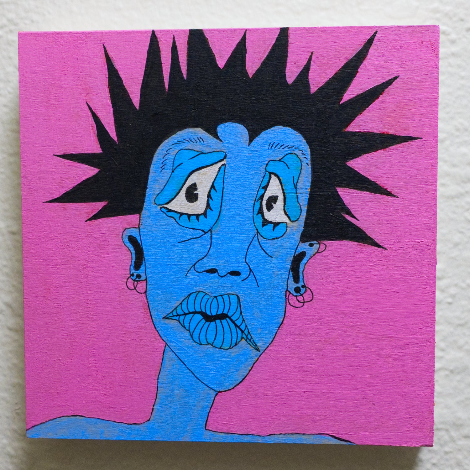 Artistic depiction of a face with blue skin and black spiky hair on a pink background