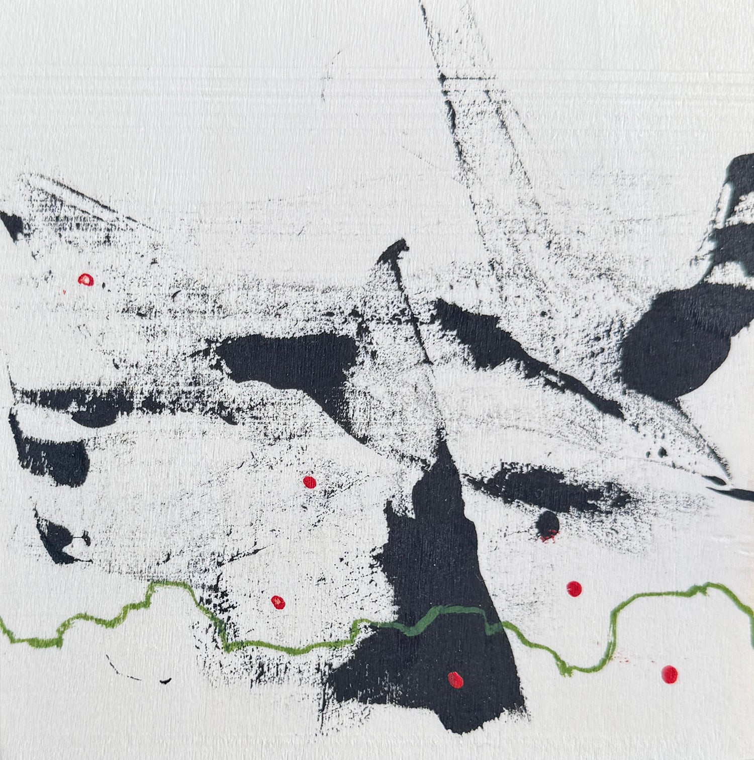 Abstract art with black, white, and red colors on a textured surface