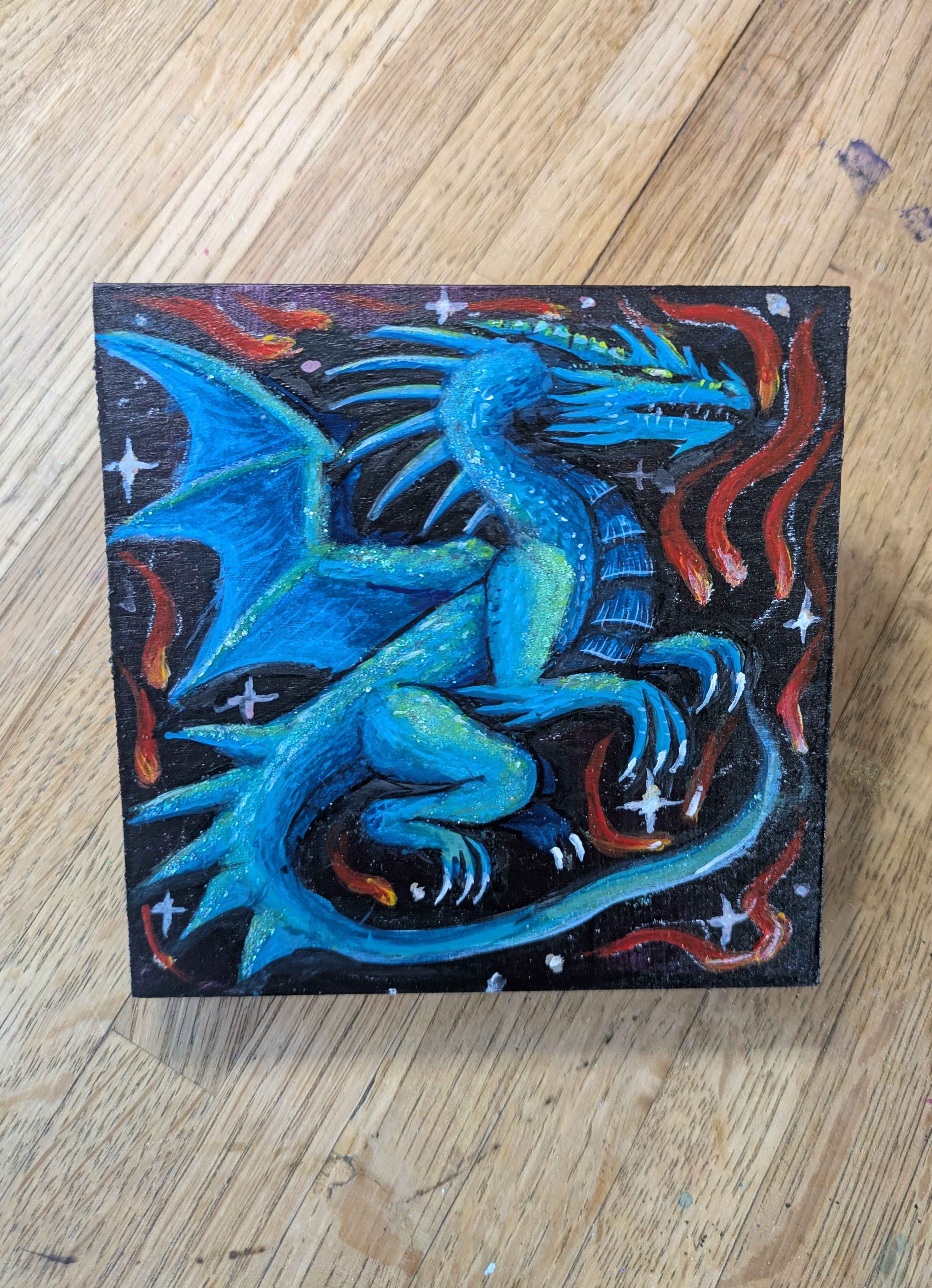 Colorful dragon painting on a wooden surface