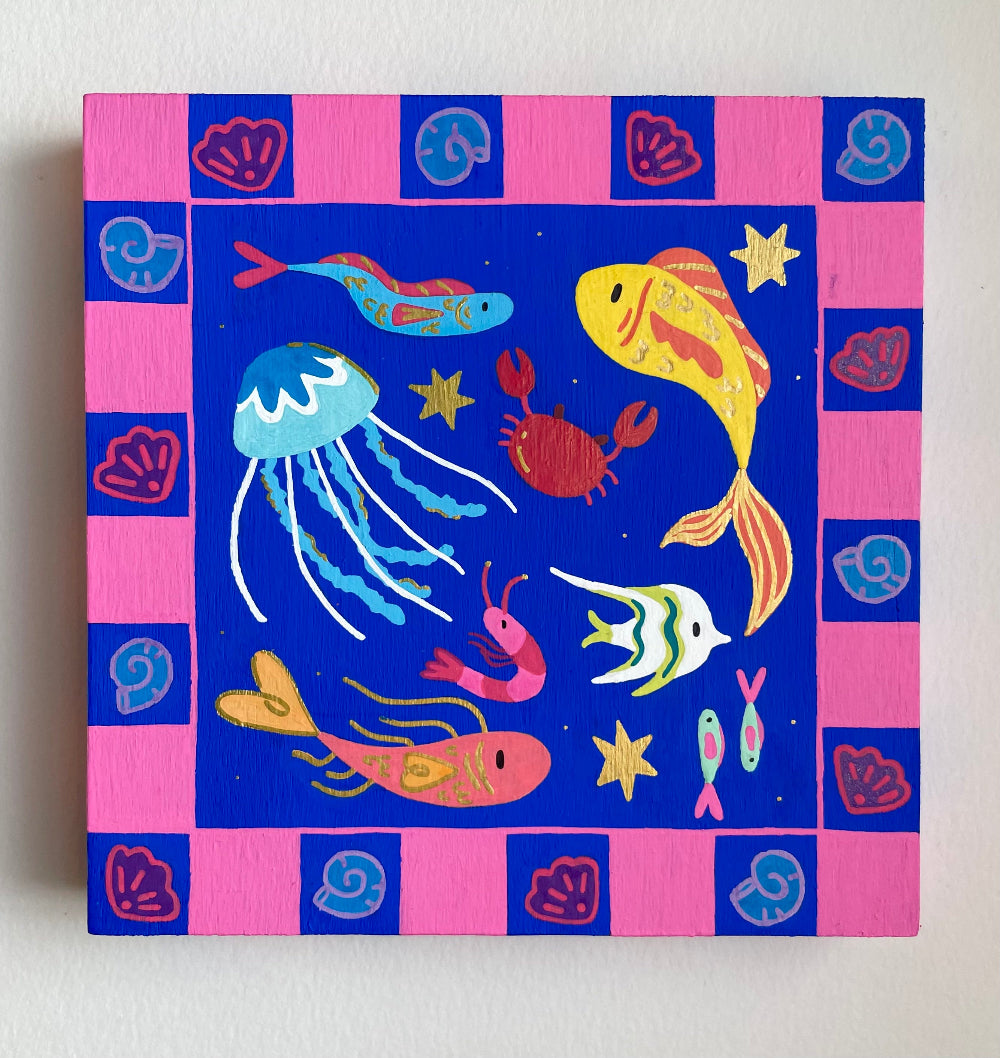 Canvas painting of sea creatures on a blue and pink checkered background