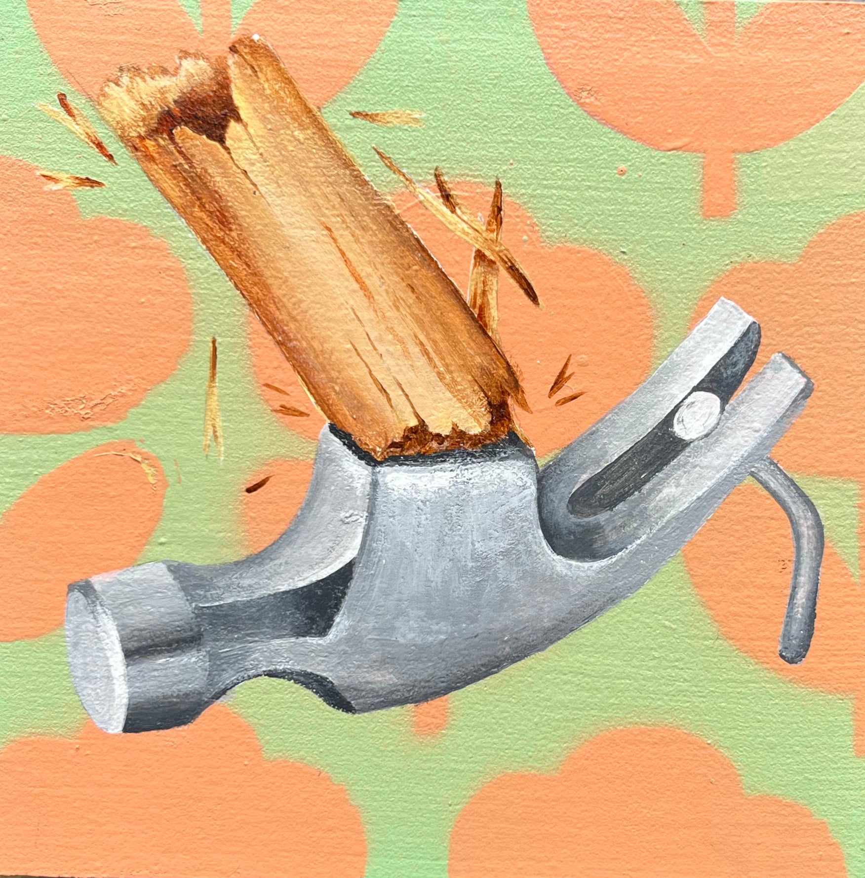 Hammer with a piece of wood on a patterned background