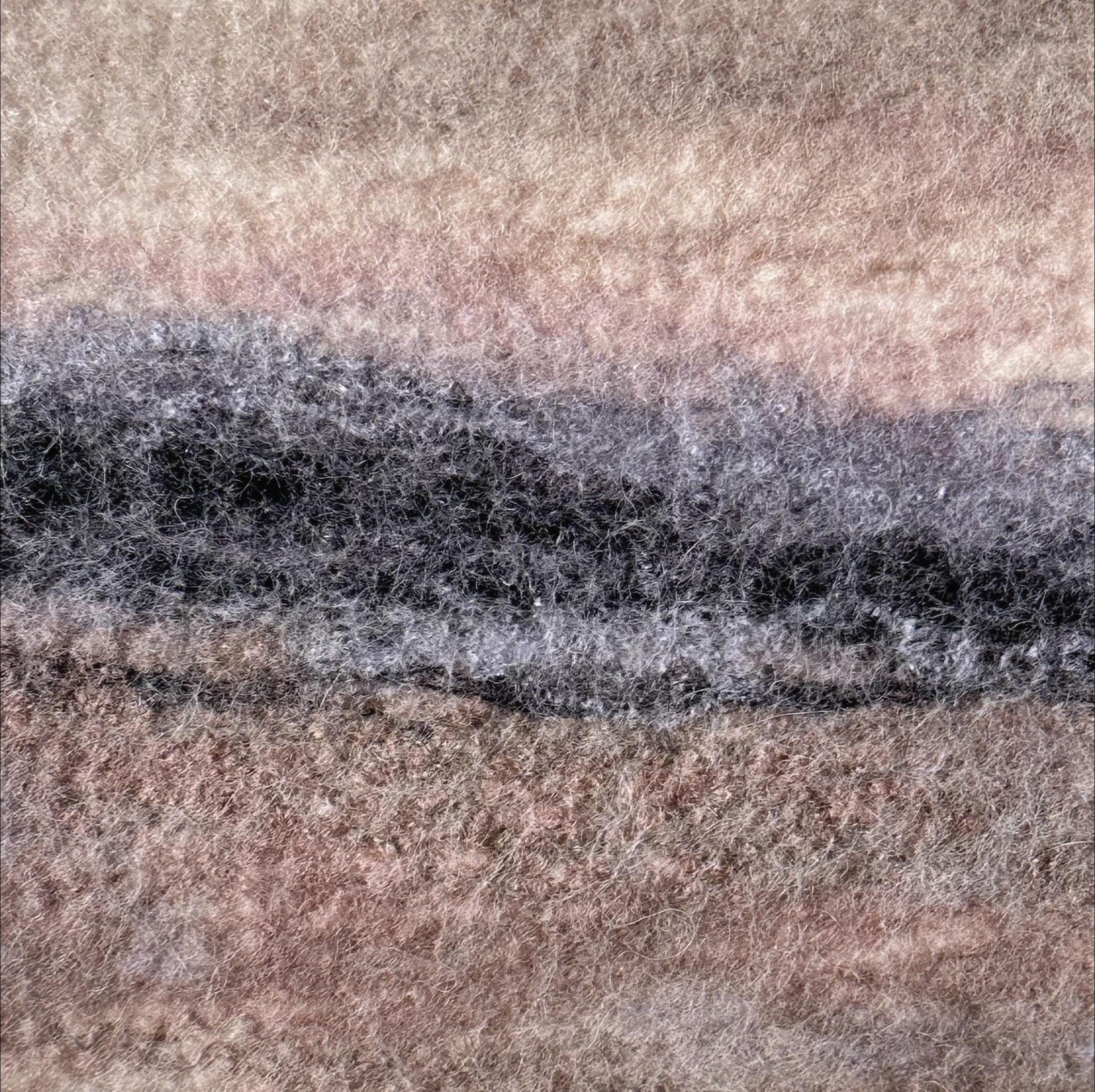 Textured pattern with earthy tones and a gradient effect.