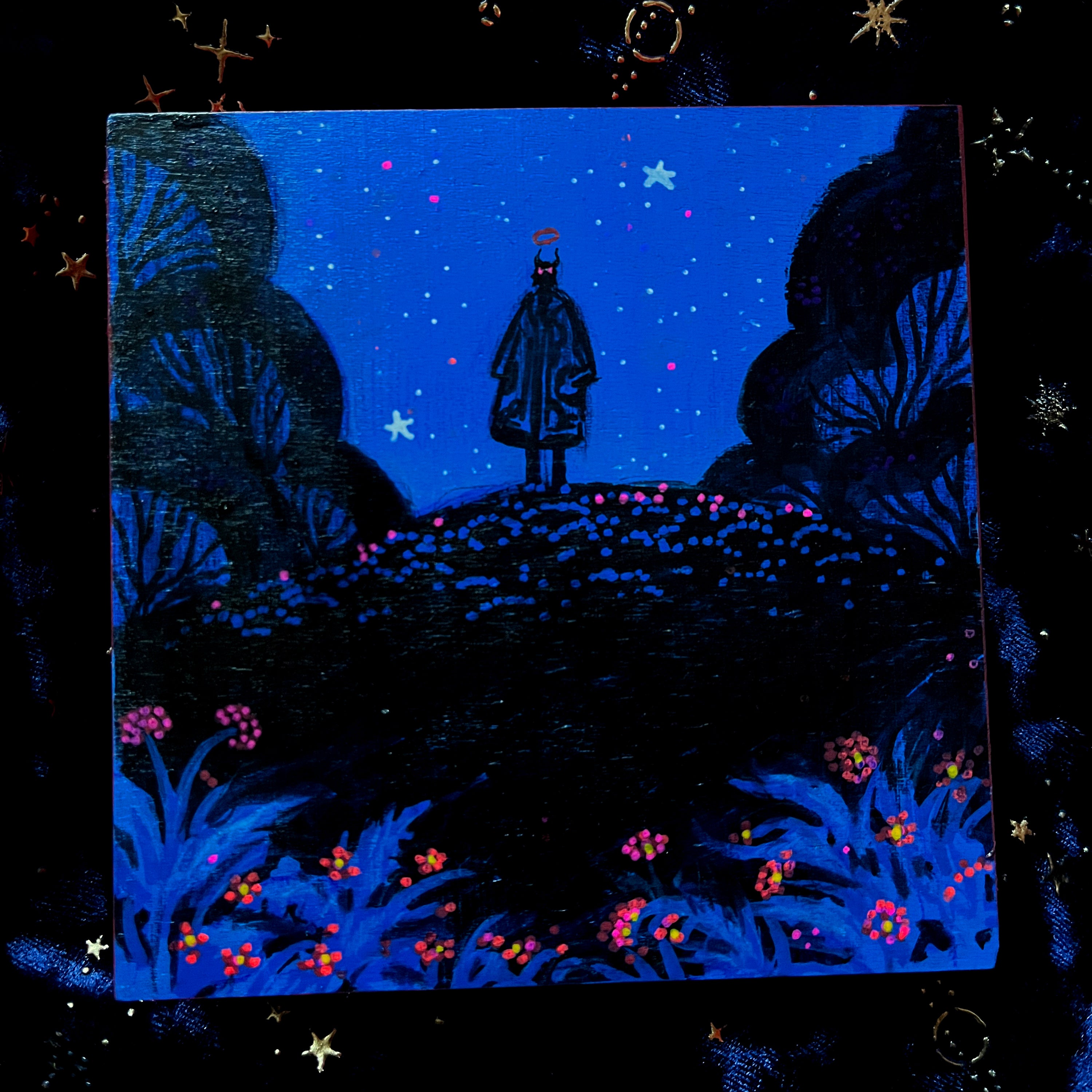 Silhouette of a person standing in a mystical forest with glowing flowers under a starry night sky.