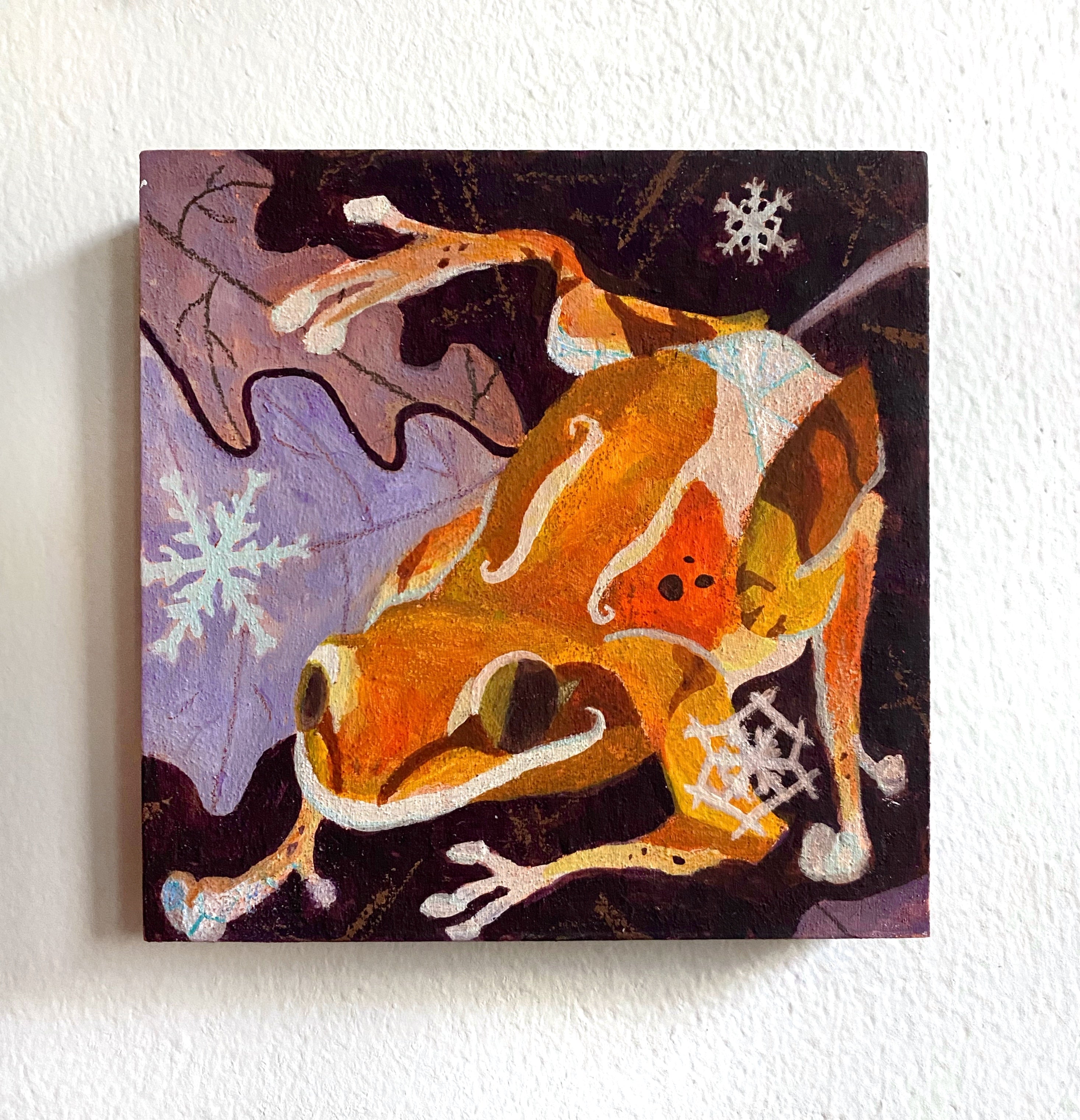 Abstract painting of a dog with snowflakes on a white wall