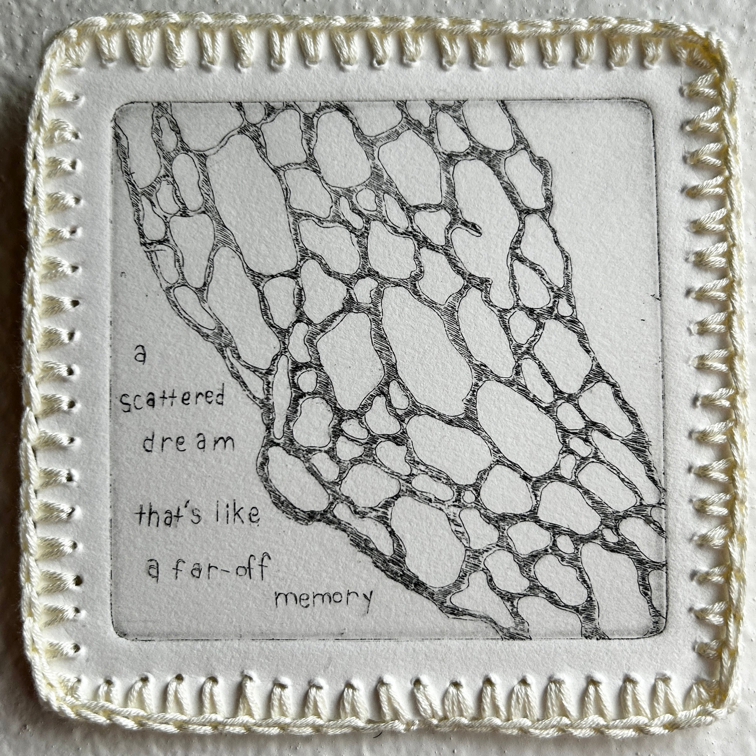 Decorative square tile with lace pattern and text on a textured surface