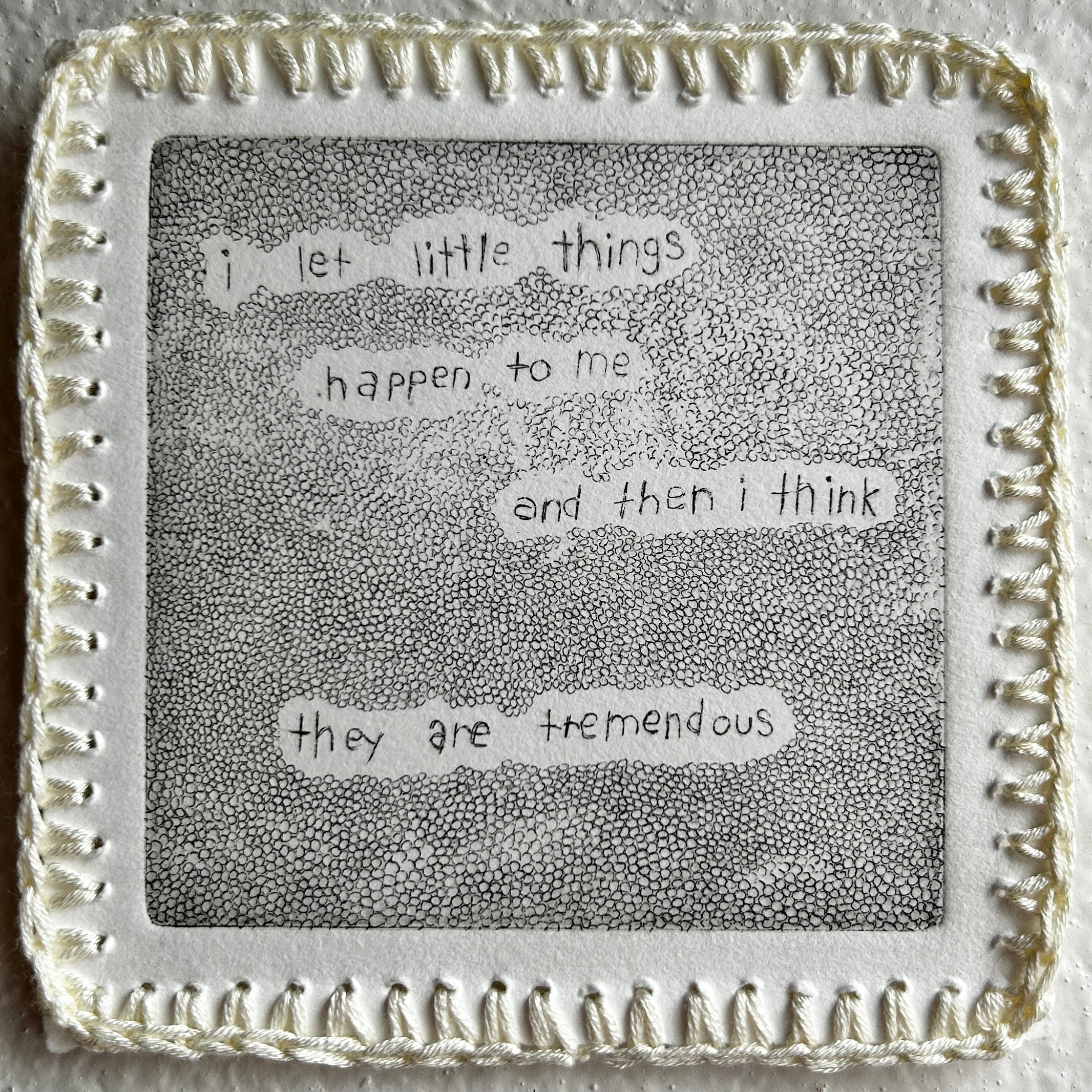 Text on a textured surface with decorative border