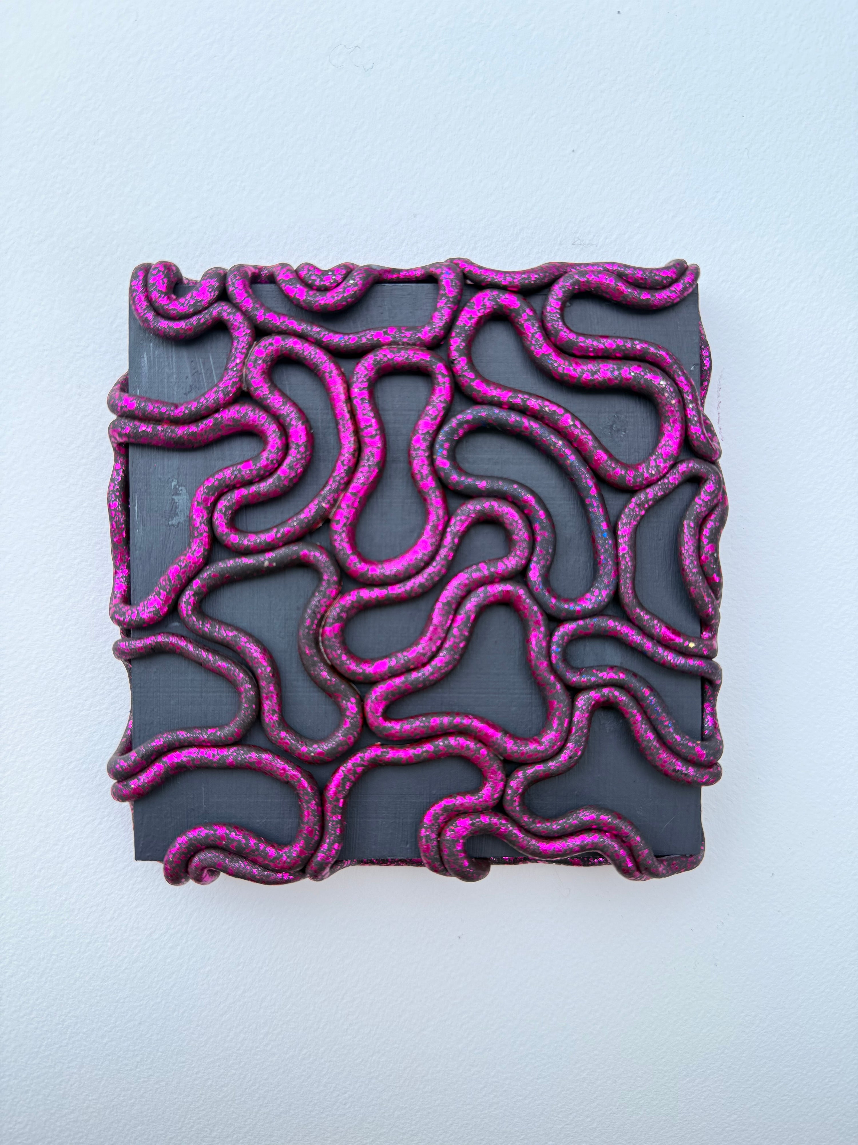 Decorative wall tile with pink wavy patterns on a gray background