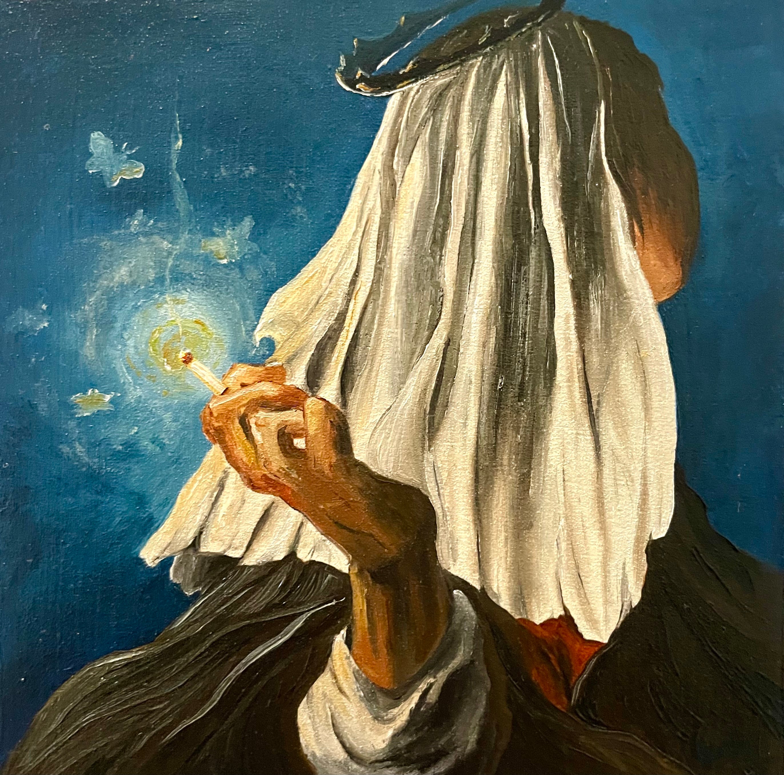 Person holding a glowing object against a blue background