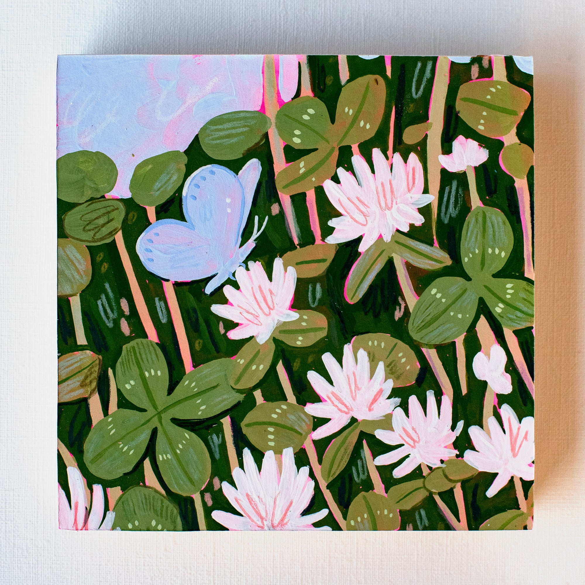 Canvas print with a butterfly and floral design on a green background