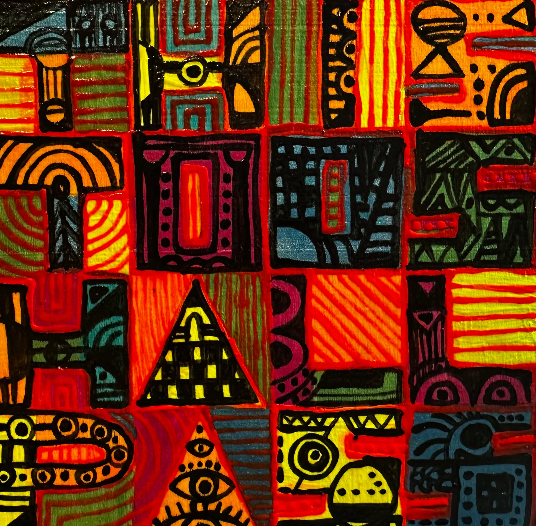 Colorful abstract pattern with geometric shapes and symbols on a textured fabric background.